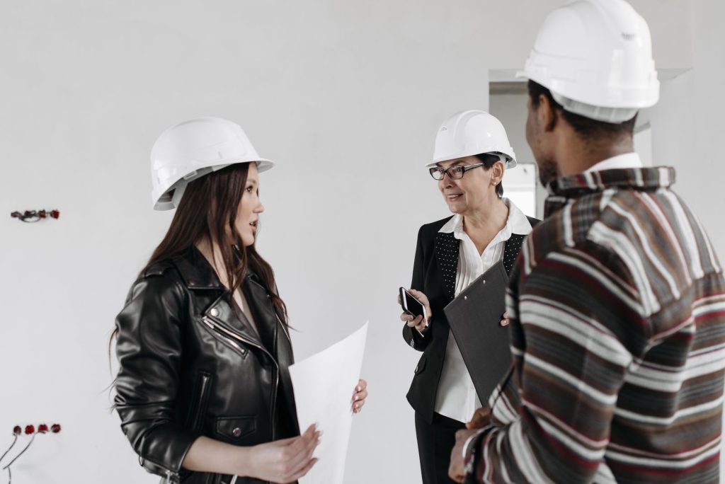 Project team reviewing plans with an electrical contractor
