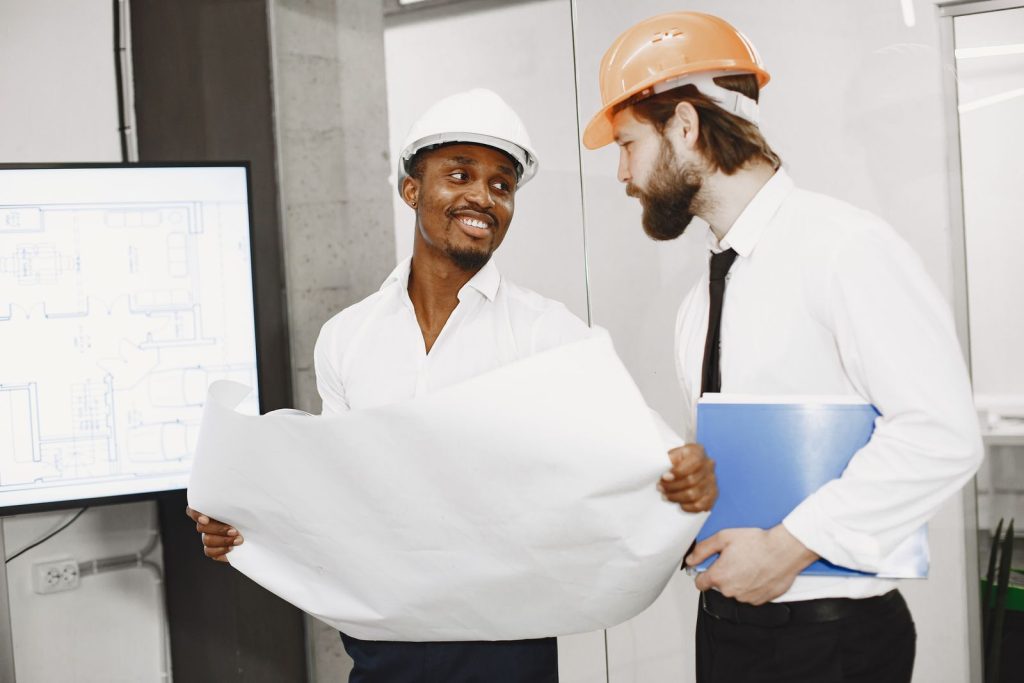 Project leads reviewing electrical drawings together